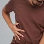 Person suffering an intercostal strain.